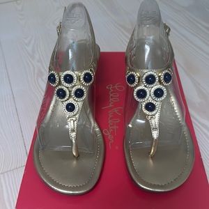 Lilly Pulitzer Gold sandal with navy stones and rhinestone accent. Gently used.